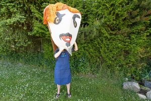 Artist at work - photo by Blair Mann, Giant puppet head by Odette Laramee